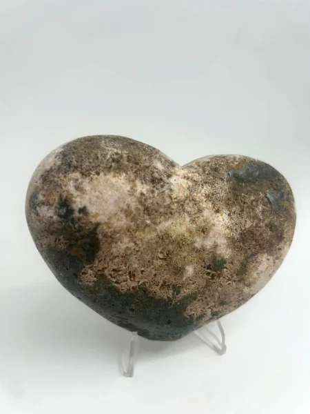 Back of Pink Amethyst heart showing natural dark earthy matrix and quartz formations