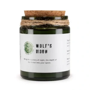 Wolf's Moon Woodwick Soy Candle in green glass jar with cork lid