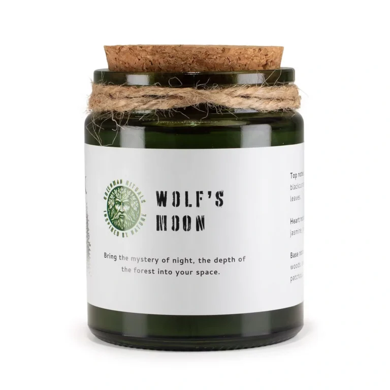 Wolf's Moon Woodwick Soy Candle in green glass jar with cork lid